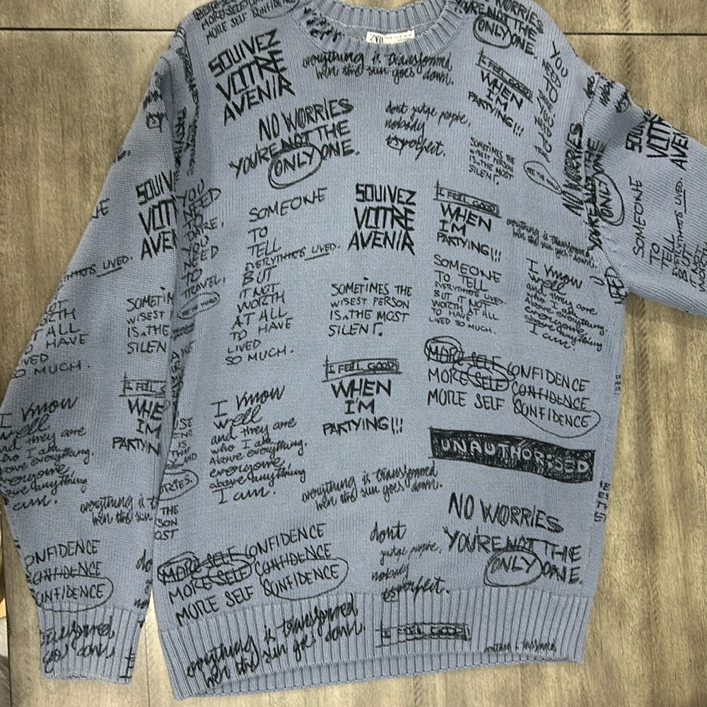 Knit crewneck with words/phrases as design